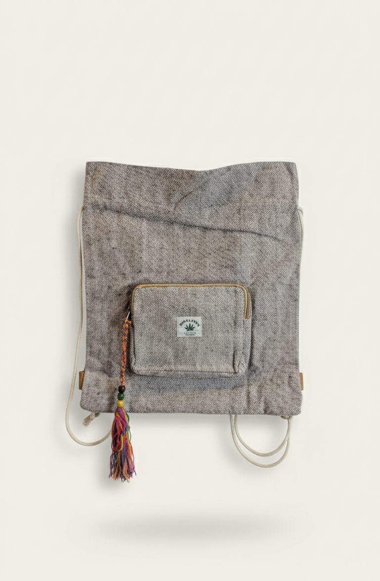 Foldable gray fabric bag with a pocket on a beige background